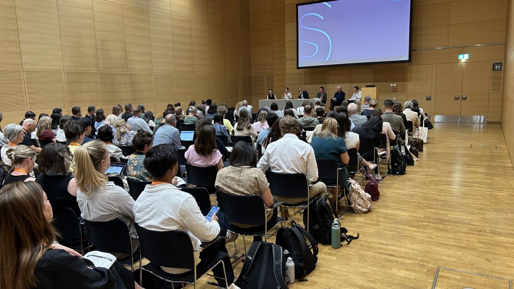 A large audience gathers for a standing-room-only session focused on Youth Mental Health Online at the World Congress on Suicide Prevention 2025 in Vienna.